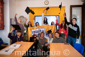 Language school students with course completion certificates