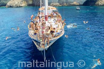 English students on a boat trip in Malta getting ready to jump into the sea