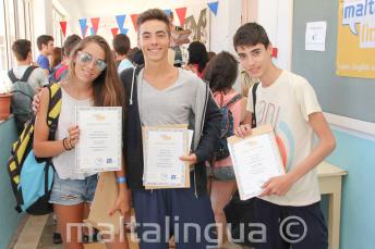 3 students with their course completion certificates