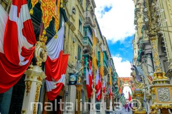A street in Valletta, Malta decorated with flags