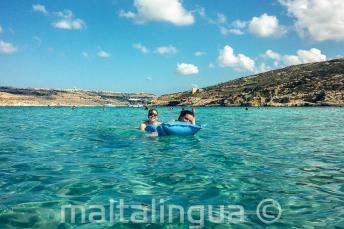 Language school students swimming in the Blue Lagoon at Comino