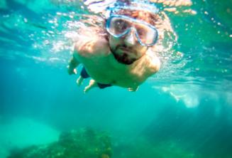 A student snorkelling