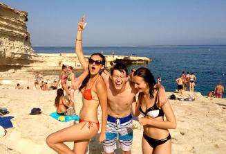 3 teen students on a language school trip to St Peters Pool, Malta