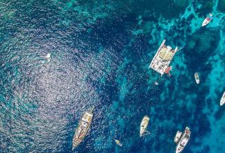 Arial photo of boats in Crystal Bay, Comino