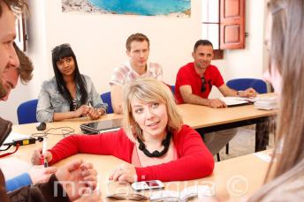An English teacher delivering a language course in our school in Malta.