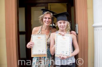 A mother and child who have both completed a language course