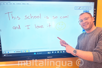 An English student who has written good feedback on the board
