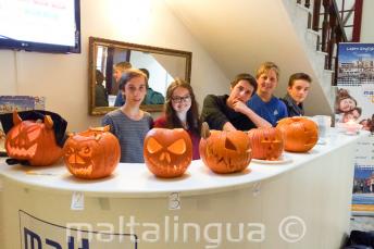 Junior students with carved Halloween pumpkins at the school reception