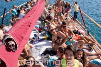 Students are sunbathing deck on the boat