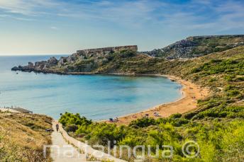 A vista of a sandy beach in Mellieha, Malta