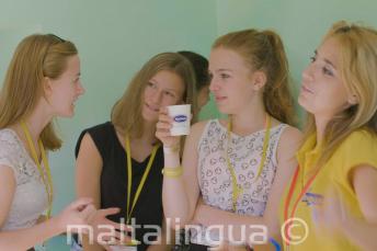 Teacher and group leader talking with studetns