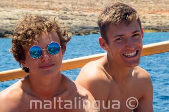 2 boys smiling on a school boat trip