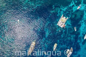 Arial photo of boats in Crystal Bay, Comino