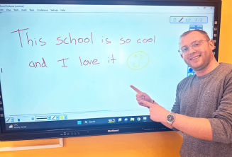 An English student who has written good feedback on the board