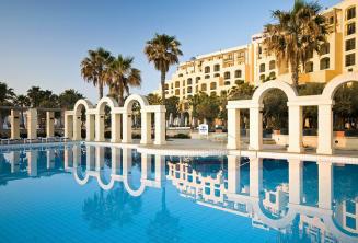 The outdoor swimming pool of the Hilton in St Julians, Malta