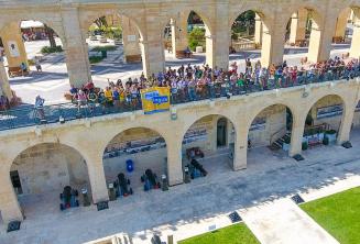 Maltalingua students waving from the Upper Barrakka, Valletta