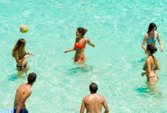 Junior school students playing volleyball at the Blue Lagoon, Malta