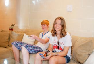 Students sitting on the sofa in host family accommodation