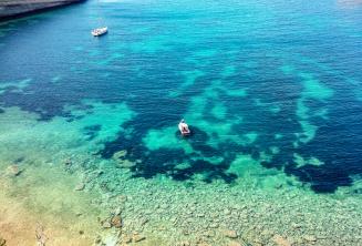 View of a bay in Malta with clear aquamarine water