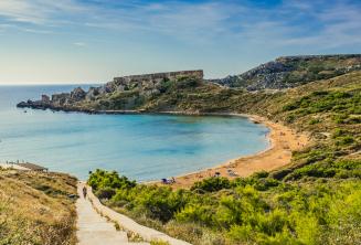 A vista of a sandy beach in Mellieha, Malta