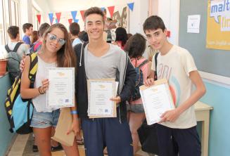 3 students with their course completion certificates