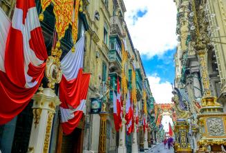 A street in Valletta, Malta decorated with flags