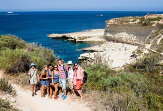 English students visiting St Peter's Pool, Malta