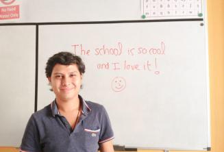 An English student who has written good feedback on the board