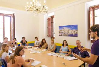 Students listening to the teacher in an English language class